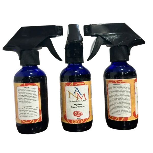 Three bottles of spray on a black background